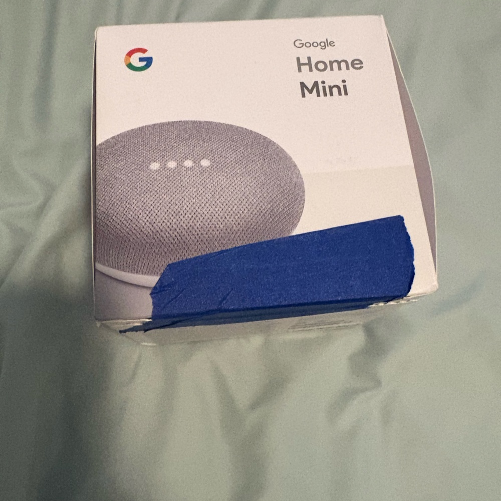 google Home Mini — Gray and White Accent Tech Speaker